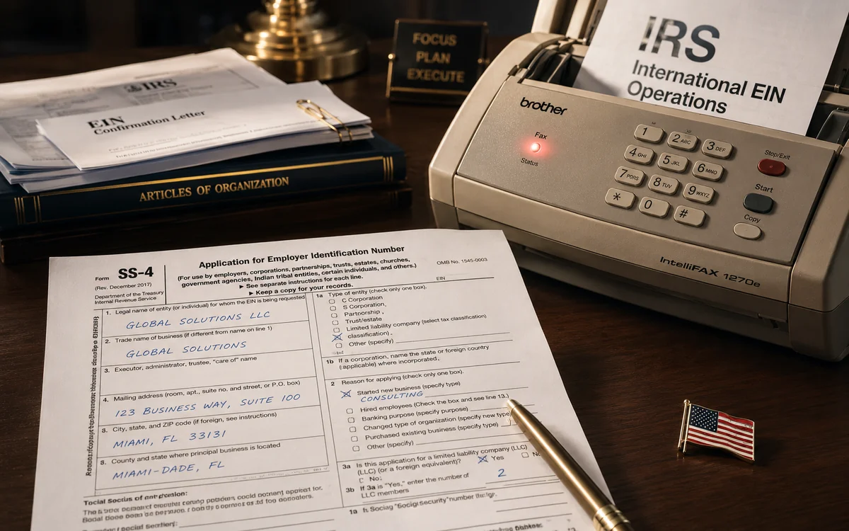 A filled-out IRS Form SS-4 on a desk, with a fax machine showing a connection indicator and a printout listing the IRS international fax number — a visual for filing an EIN application from outside the US